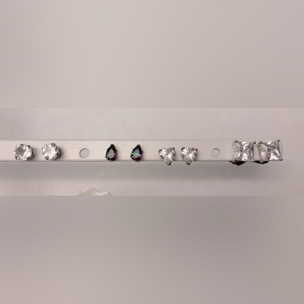 Four pairs of white gold tone stud earrings; CZ (3) and mystic topaz (1)
